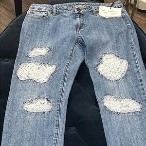 GORGEOUS,MICHAEL KORS light jeans,with patches over the front. in a size 2